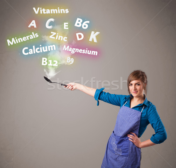 Jeune femme cuisson vitamines minéraux joli alimentaire [[stock_photo]] © ra2studio