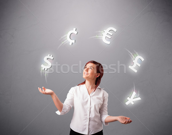  young lady standing and juggling with currency icons Stock photo © ra2studio