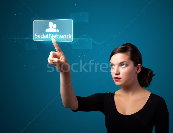 Businesswoman pressing modern social type of icons Stock photo © ra2studio