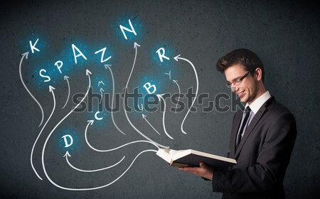 Young man reading a book while multiple choices are coming out of the book Stock photo © ra2studio