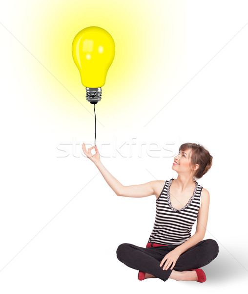 Heureux femme ampoule ballon jeune femme [[stock_photo]] © ra2studio