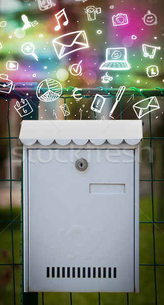 Colorful icons and symbols bursting out of a mailbox Stock photo © ra2studio