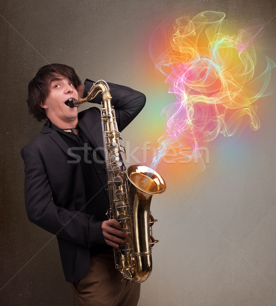 Séduisant musicien jouer saxophone coloré résumé [[stock_photo]] © ra2studio