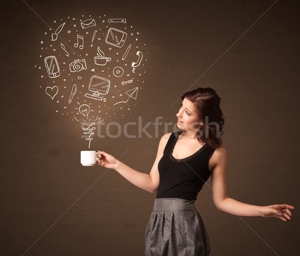 Businesswoman holding a white cup with social media icons Stock photo © ra2studio
