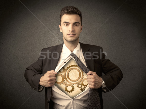 Businessman tearing shirt off and machine cog wheel shows Stock photo © ra2studio