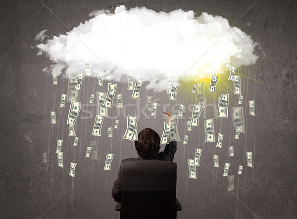 Business man in suit looking at cloud with falling money Stock photo © ra2studio