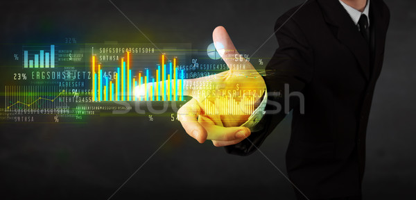 Stock fotó: Fiatal · üzletember · megérint · színes · táblázatok · diagramok