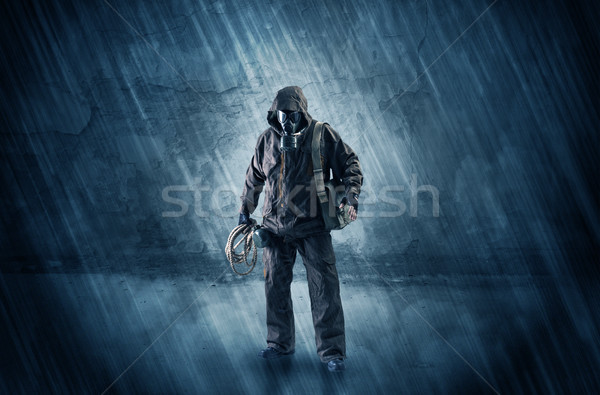 Peril man in front of a crumbly wall Stock photo © ra2studio