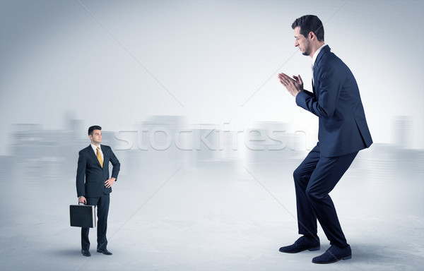 Gigant biznesmen przestraszony mały poważny człowiek Zdjęcia stock © ra2studio