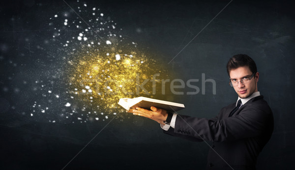 Young guy reading a magical book Stock photo © ra2studio