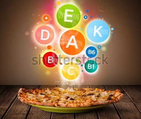 Food plate with delicious meal and healthy vitamin symbols Stock photo © ra2studio
