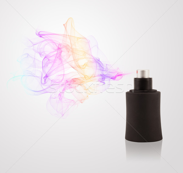 Perfume bottle spraying colored scent Stock photo © ra2studio