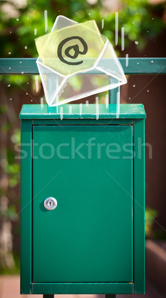 Envelope with email sign dropping into mailbox Stock photo © ra2studio