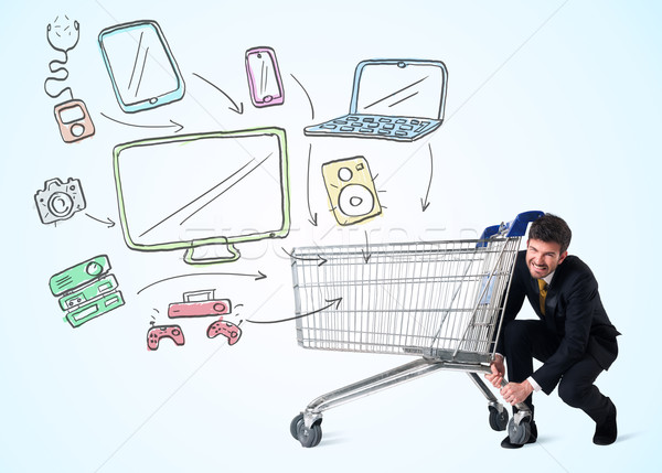 Businessman with shopping cart Stock photo © ra2studio