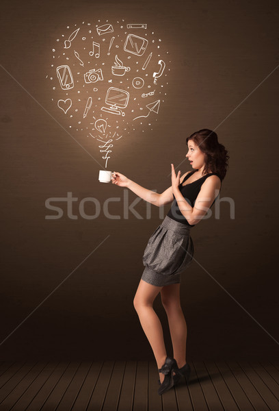 Businesswoman holding a white cup with social media icons Stock photo © ra2studio