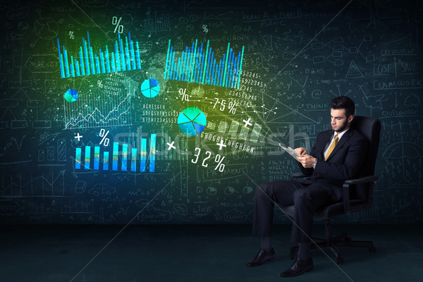 Businessman in office chair with tablet in hand and high tech gr Stock photo © ra2studio