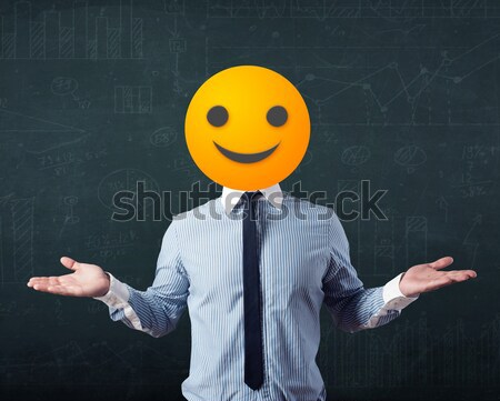 businessman wears yellow smiley face Stock photo © ra2studio