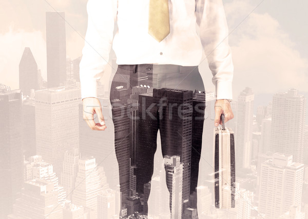 Handsome business man with overlay cityscape Stock photo © ra2studio