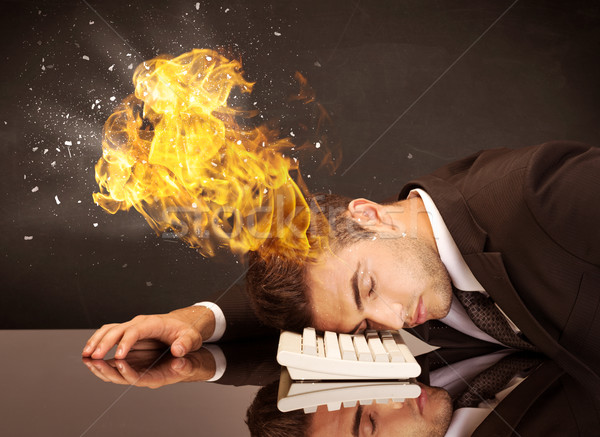 Stressed business man's head is burning Stock photo © ra2studio