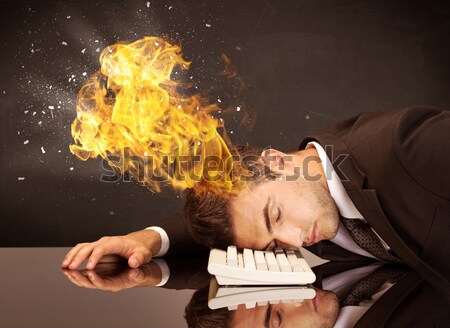 Stressed business man's head is burning Stock photo © ra2studio