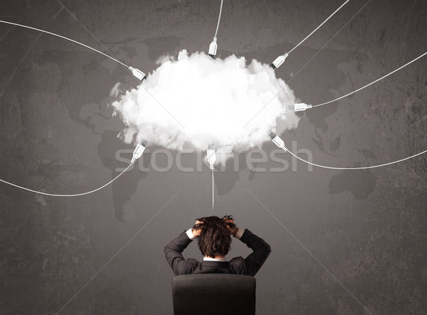 Fiatalember néz felhő átutalás világ szolgáltatás Stock fotó © ra2studio