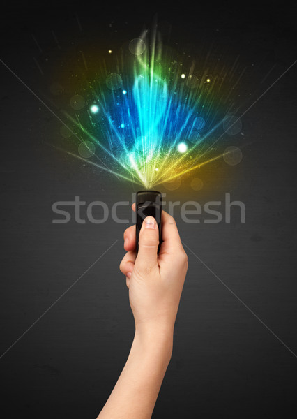 Hand with remote control and explosive signal Stock photo © ra2studio