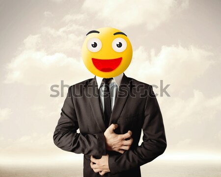 businessman wears yellow smiley face Stock photo © ra2studio