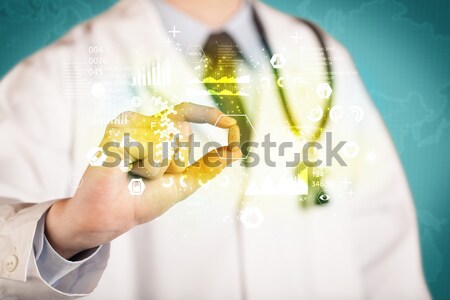 A doctor in tie holding a pill Stock photo © ra2studio