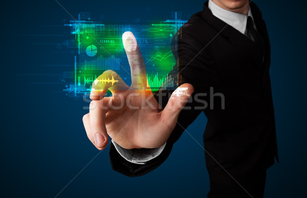 Young businessman pressing modern technology panel with finger p Stock photo © ra2studio