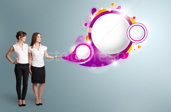 Attractive woman presenting abstract speech bubble copy space Stock photo © ra2studio