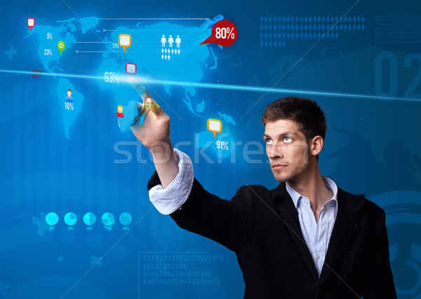 Businessman pressing social media button on digital map Stock photo © ra2studio