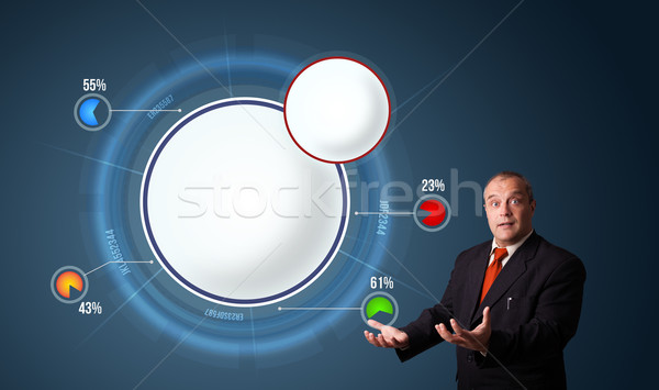 businessman in suit presenting abstract modern pie chart Stock photo © ra2studio