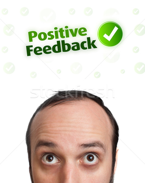 Young head looking at positive negative signs Stock photo © ra2studio