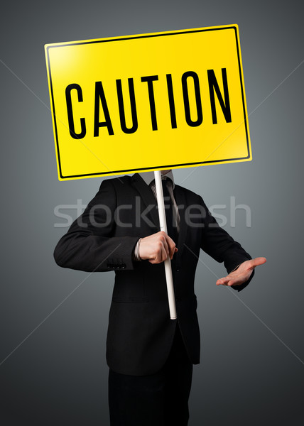 Geschäftsmann halten Vorsicht Zeichen stehen gelb Stock foto © ra2studio