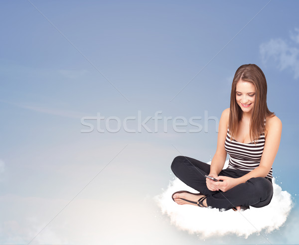 Young woman sitting on cloud with copy space Stock photo © ra2studio