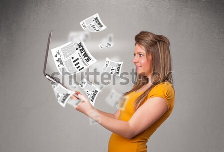 Casual young woman holdin notebook and reading the explosive new Stock photo © ra2studio