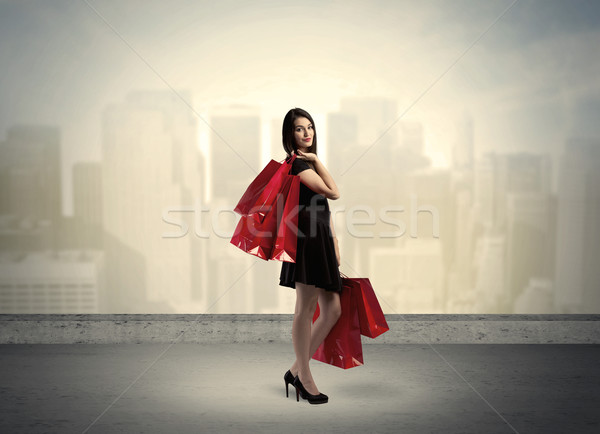 City woman standing with shopping bags Stock photo © ra2studio