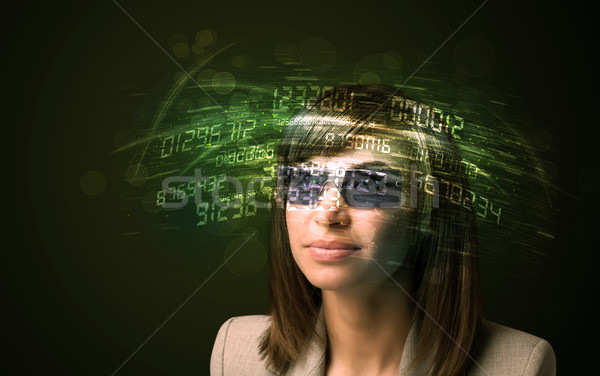 Business woman looking at high tech number calculations  Stock photo © ra2studio