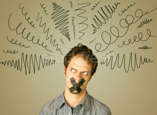 Young man with glued mouth and curly lines Stock photo © ra2studio