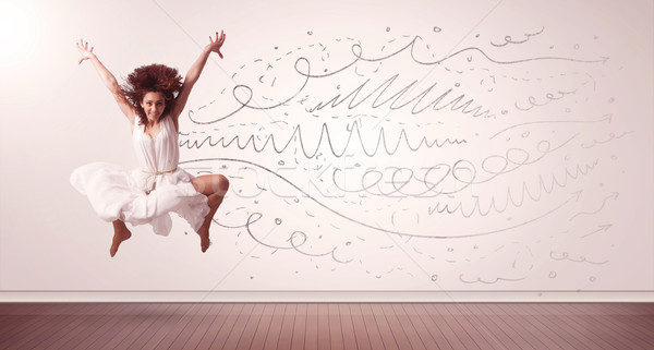 Pretty woman jumping with hand drawn lines and arrows come out Stock photo © ra2studio