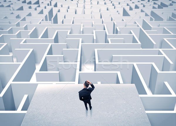 Businessman staring at infinite maze Stock photo © ra2studio