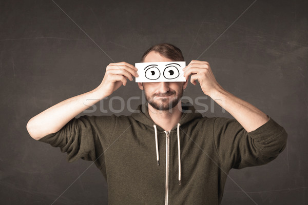 Funny man looking with hand drawn paper eyes Stock photo © ra2studio