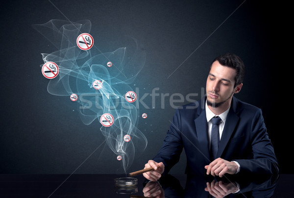 Empresário fumador flutuante sinais Foto stock © ra2studio