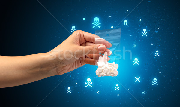 Handing over pills with skulls Stock photo © ra2studio
