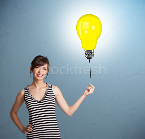 Joli dame ampoule ballon jeune femme [[stock_photo]] © ra2studio