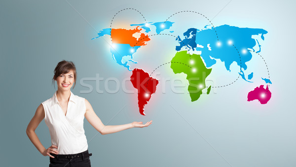 Young woman presenting colorful world map Stock photo © ra2studio