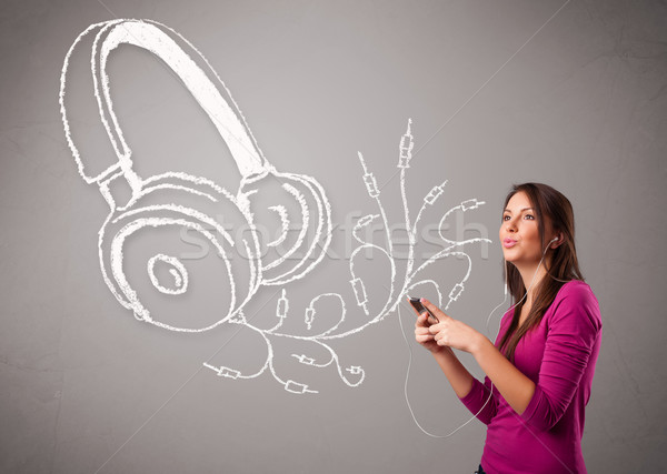 young woman singing and listening to music with abstract headphone Stock photo © ra2studio