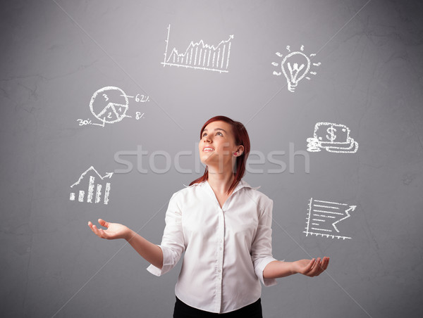 beautiful young woman juggling with statistics and graphs Stock photo © ra2studio