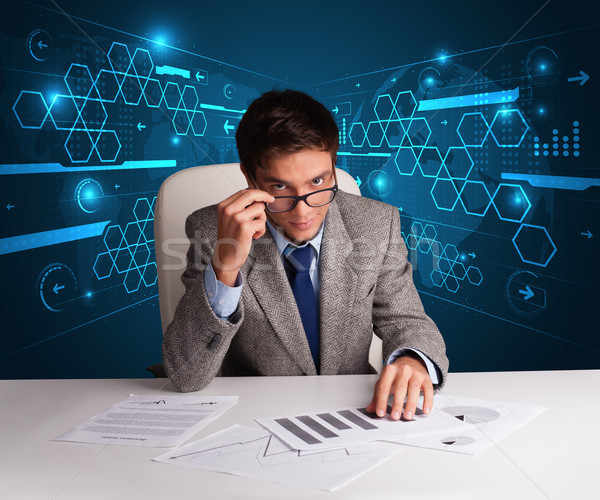 Stock photo: Businessman doing paperwork with futuristic backgroung