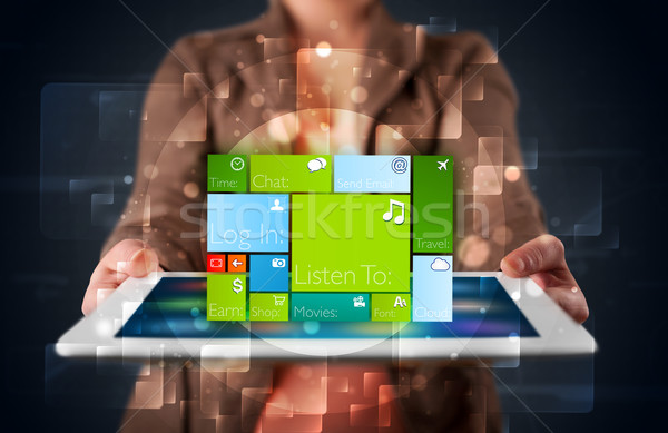 Lady holding tablet with modern software operational system Stock photo © ra2studio